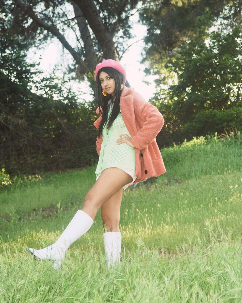 Customer @_sophiaagabriellee wearing a pink beret, a pink teddy coat over a light green button down shirt, and white knee-high boots. Customer @_sophiaagabriellee wearing a pink beret, a pink teddy coat over a light green button down shirt, and white knee-high boots.