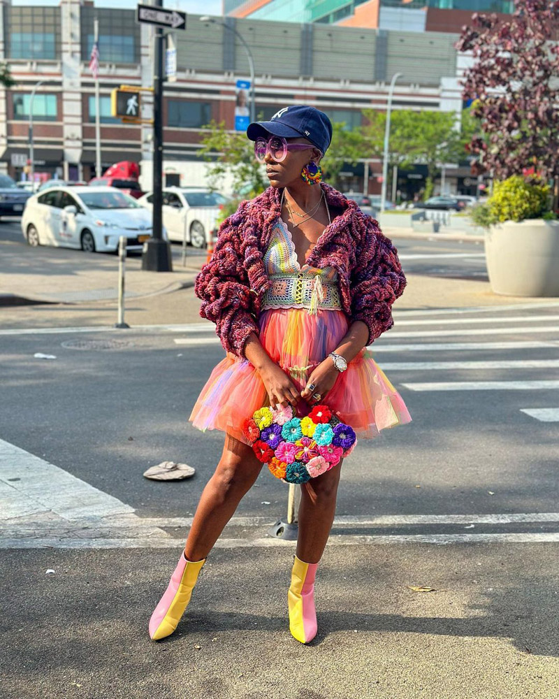 Customer @theemodernhousewifeny wearing a chunky purple cardigan and a rainbow crochet tank top, tulle skirt, and patchwork handbag @theemodernhousewifeny wearing a chunky purple cardigan and a rainbow crochet tank top, tulle skirt, and patchwork handbag